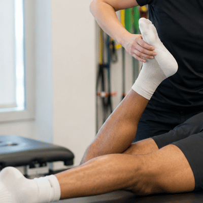 A physical therapist conducts a hamstring strength assessment on an athlete to evaluate readiness for return to sport and track hamstring strain recovery time progress