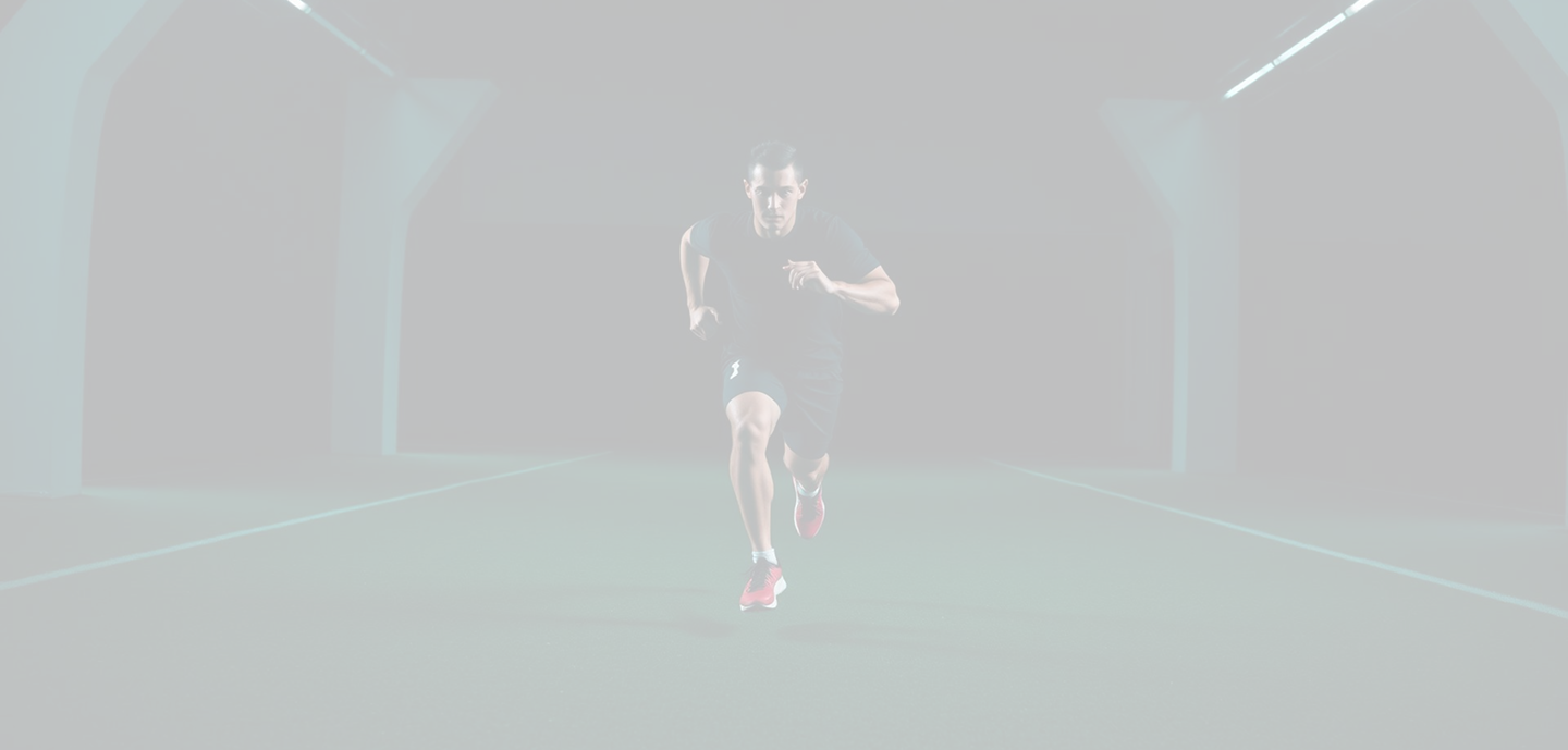 Athlete running during a performance training session.